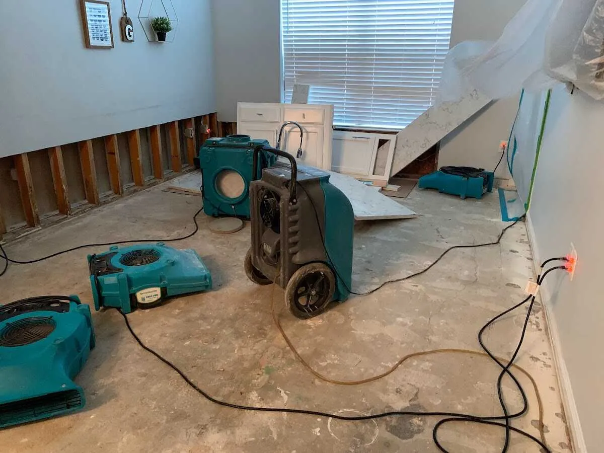 Dehumidifier in flood-cut room for Water Damage Restoration in Maysville
